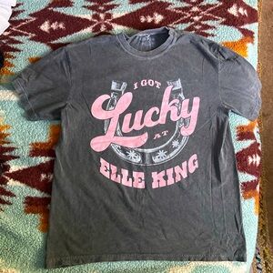 I got lucky at Elle king shirt size large. Worn and washed once. Gray and pink